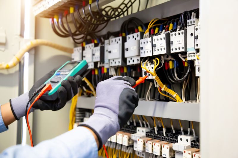 Electrician Working on a Panel